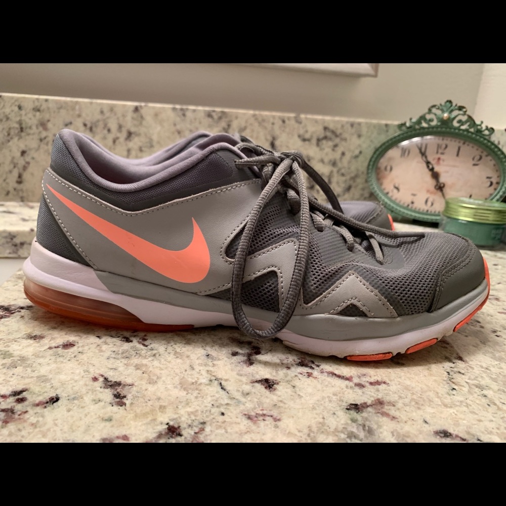 Grey Nikes with peach-colored stripe